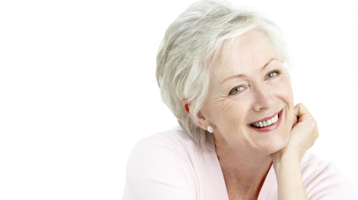 Studio Portrait Of Smiling Senior Woman
